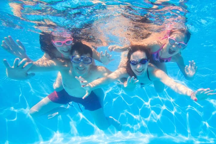 Family enjoying pool after gym in Cardiff